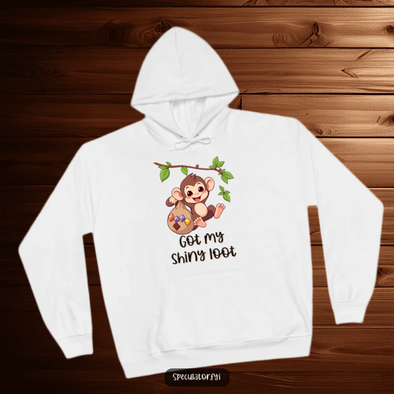 Funny hoodie graphic of a playful monkey swinging from a vine, holding a bag of gems, exuding joy and a sense of treasure.